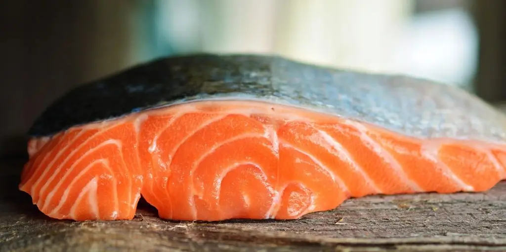 A fresh salmon, widely favored for its taste and health benefits, particularly its contribution to Vitamin D intake.